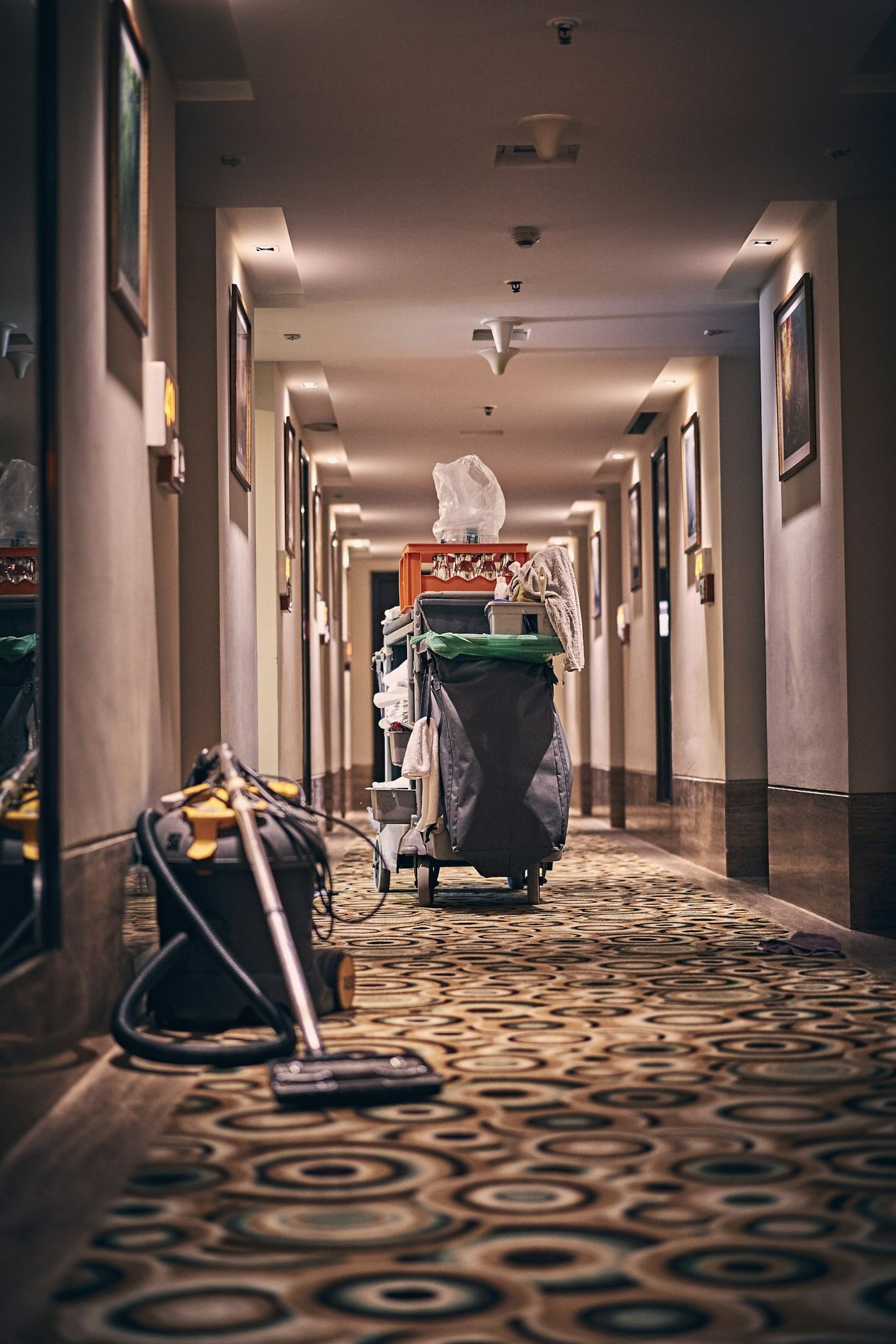 Residential hallway with professional drying equipment running after water damage