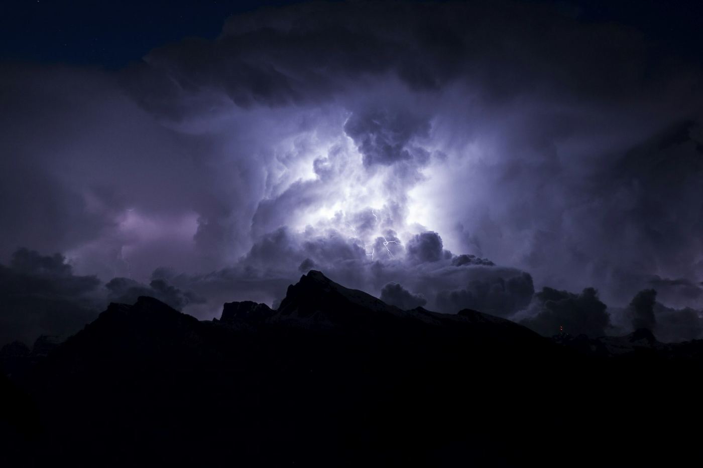 Dark monsoon storm clouds gathering over the Arizona desert at night